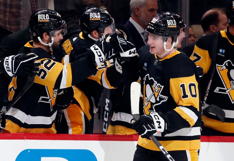 Feb 25, 2024; Pittsburgh, Pennsylvania, USA;  Pittsburgh Penguins left wing Drew O'Connor (10) celebrates his goal with the Pens bench against the Philadelphia Flyers during the third period at PPG Paints Arena.  Pittsburgh won 7-6. Mandatory Credit: Charles LeClaire-USA TODAY Sports