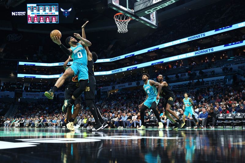 CHARLOTTE, NORTH CAROLINA - MARCH 27: Miles Bridges #0 of the Charlotte Hornets attempts a shot against the Cleveland Cavaliers during the first half of the game at Spectrum Center on March 27, 2024 in Charlotte, North Carolina. NOTE TO USER: User expressly acknowledges and agrees that, by downloading and or using this photograph, User is consenting to the terms and conditions of the Getty Images License Agreement. (Photo by Jared C. Tilton/Getty Images)