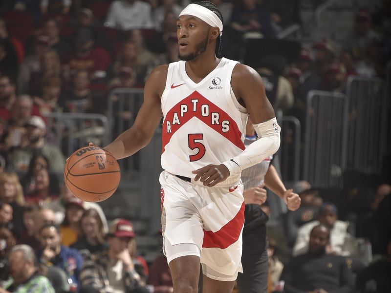 CLEVELAND, OH - JANUARY 9: Immanuel Quickley #5 of the Toronto Raptors dribbles the ball during the game against the Cleveland Cavaliers on January 9, 2025 at Rocket Mortgage FieldHouse in Cleveland, Ohio. NOTE TO USER: User expressly acknowledges and agrees that, by downloading and/or using this Photograph, user is consenting to the terms and conditions of the Getty Images License Agreement. Mandatory Copyright Notice: Copyright 2025 NBAE (Photo by David Liam Kyle/NBAE via Getty Images)