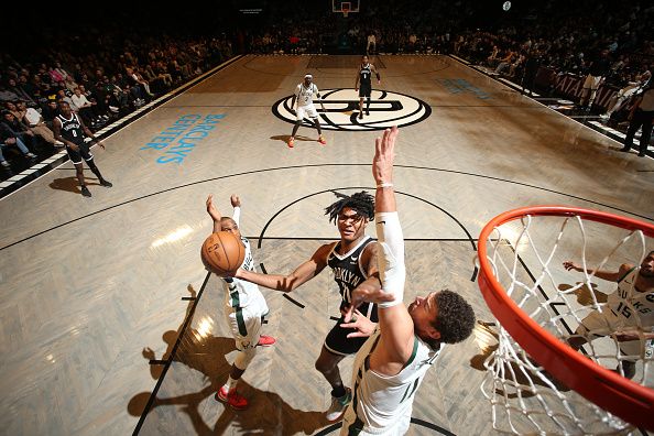 BROOKLYN, NY - DECEMBER 27: Noah Clowney #21 of the Brooklyn Nets  drives to the basket during the game against the Milwaukee Bucks on December 27, 2023 at Barclays Center in Brooklyn, New York. NOTE TO USER: User expressly acknowledges and agrees that, by downloading and or using this Photograph, user is consenting to the terms and conditions of the Getty Images License Agreement. Mandatory Copyright Notice: Copyright 2023 NBAE (Photo by Nathaniel S. Butler/NBAE via Getty Images)