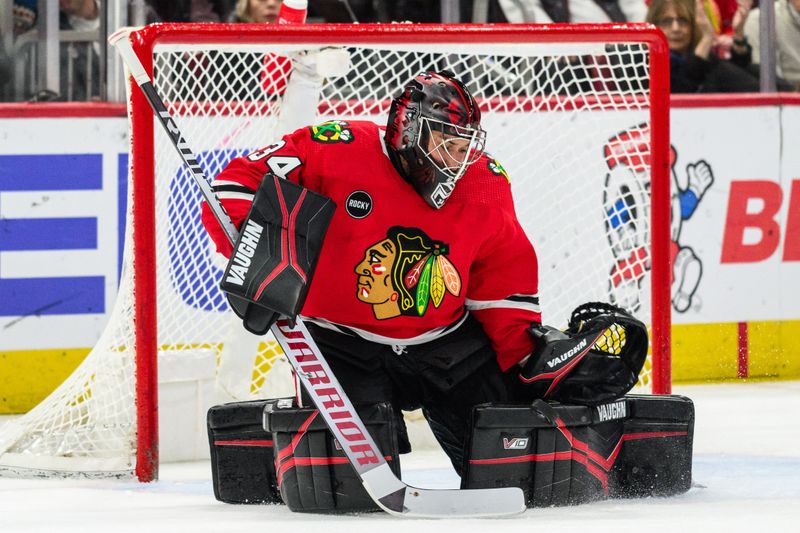 Feb 9, 2024; Chicago, Illinois, USA; Chicago Blackhawks goaltender Petr Mrazek (34) makes a save against the New York Rangers during the second period at the United Center. Mandatory Credit: Daniel Bartel-USA TODAY Sports