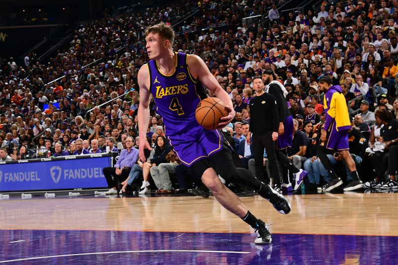 PHOENIX, AZ - OCTOBER 28: Dalton Knecht #4 of the Los Angeles Lakers dribbles the ball during the game against the Phoenix Suns on October 28, 2024 at Footprint Center in Phoenix, Arizona. NOTE TO USER: User expressly acknowledges and agrees that, by downloading and or using this photograph, user is consenting to the terms and conditions of the Getty Images License Agreement. Mandatory Copyright Notice: Copyright 2024 NBAE (Photo by Kate Frese/NBAE via Getty Images)