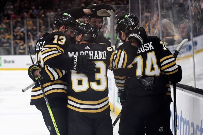 Mar 16, 2024; Boston, Massachusetts, USA; Boston Bruins left wing Jake DeBrusk (74) is congratulated by his teammates after scoring a goal during the third period against the Philadelphia Flyers at TD Garden. Mandatory Credit: Bob DeChiara-USA TODAY Sports