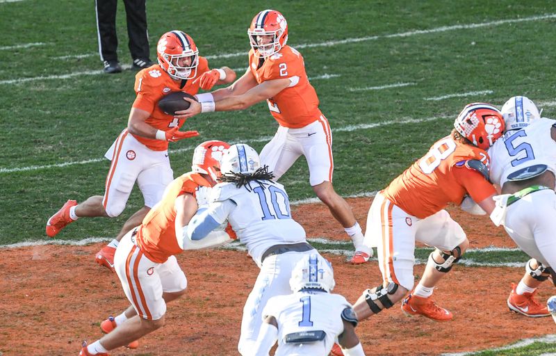 Nov 18, 2023; Clemson, South Carolina, USA; Clemson Tigersrunning back Will Shipley (1) gets a handoff from quarterback Cade Klubnik (2) while playing the North Carolina Tar Heels during the first quarter at Memorial Stadium. Mandatory Credit: Ken Ruinard-USA TODAY Sports