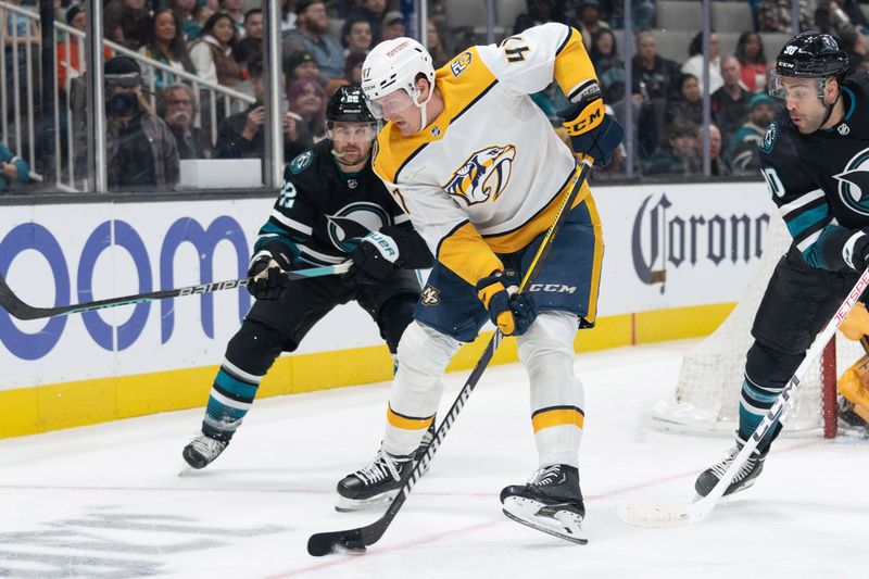 Feb 24, 2024; San Jose, California, USA; Nashville Predators right wing Michael McCarron (47) controls the puck during the second period against San Jose Sharks center Ryan Carpenter (22) at SAP Center at San Jose. Mandatory Credit: Stan Szeto-USA TODAY Sports