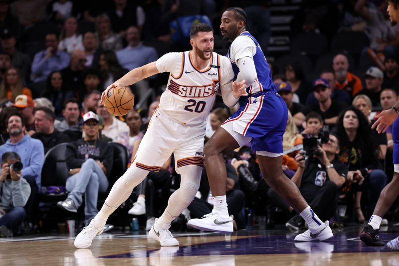 PHOENIX, ARIZONA - NOVEMBER 04: Jusuf Nurkic #20 of the Phoenix Suns posts up on Andre Drummond #5 of the Philadelphia 76ers during the first half at Footprint Center on November 04, 2024 in Phoenix, Arizona. NOTE TO USER: User expressly acknowledges and agrees that, by downloading and or using this photograph, User is consenting to the terms and conditions of the Getty Images License Agreement.  (Photo by Chris Coduto/Getty Images)