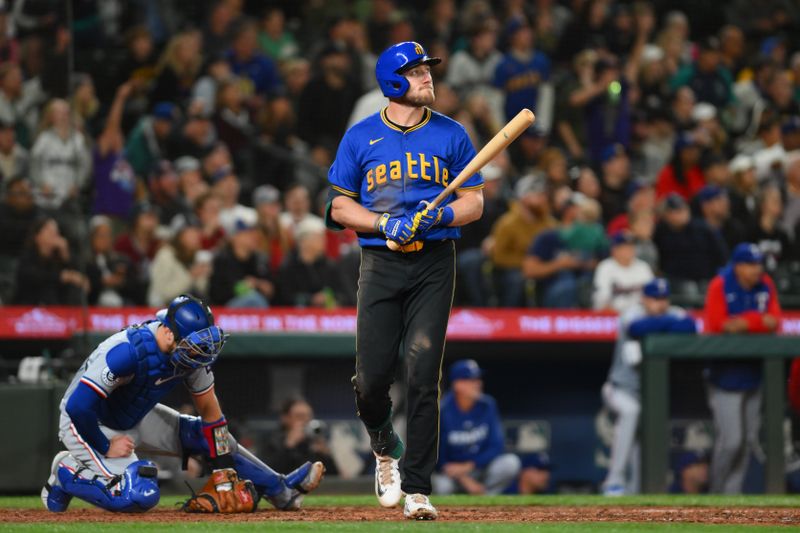 Sep 14, 2024; Seattle, Washington, USA; Seattle Mariners left fielder Luke Raley (20) walks towards first base after hitting a 2-run home run against the Texas Rangers during the fifth inning at T-Mobile Park. Mandatory Credit: Steven Bisig-Imagn Images