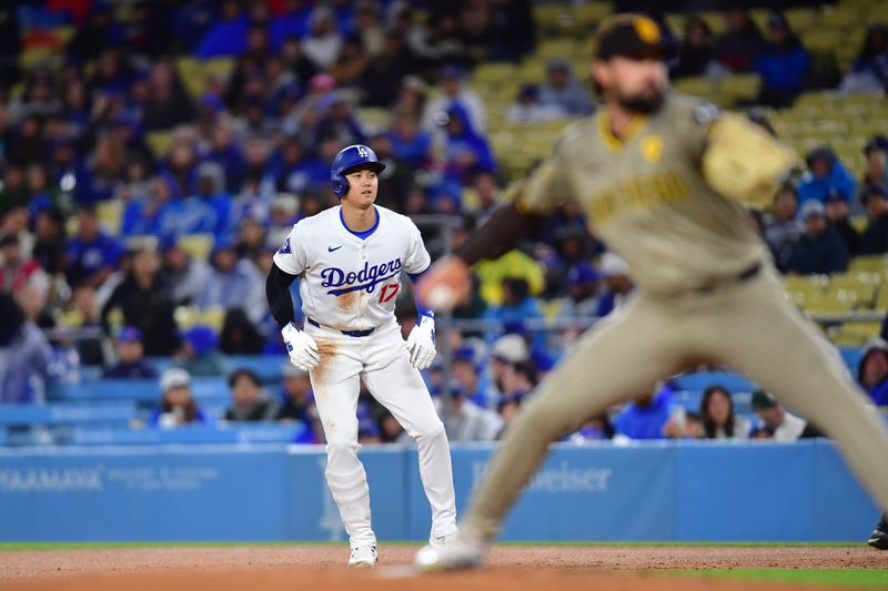 Apr 13, 2024; Los Angeles, California, USA; Los Angeles Dodgers designated hitter Shohei Ohtani (17) leads off from first as San Diego Padres starting pitcher Matt Waldron (61) throws during the first inning at Dodger Stadium. Mandatory Credit: Gary A. Vasquez-USA TODAY Sports