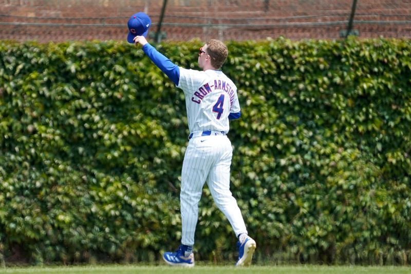 Jun 1, 2025; Chicago, Illinois, USA; Chicago Cubs outfielder Pete Crow-Armstrong (4) waves to the fans before a game between the Chicago Cubs and the Cincinnati Reds at Wrigley Field. Mandatory Credit: David Banks-Imagn Images