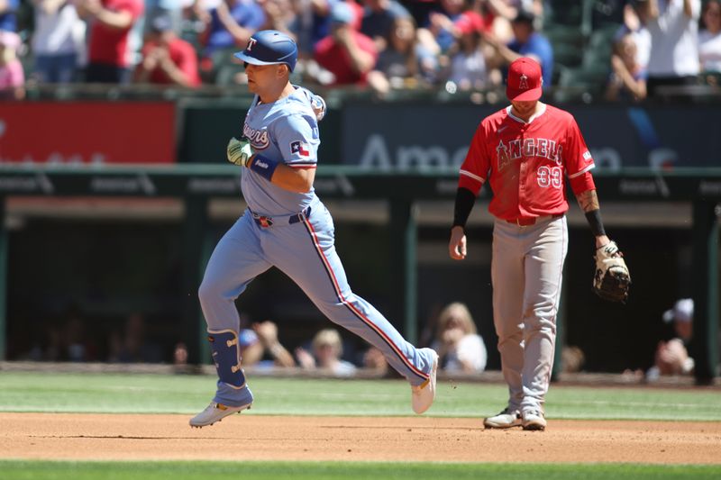 Sep 8, 2024; Arlington, Texas, USA; Texas Rangers first base Nathaniel Lowe (30) rounds the bases after hitting a two run home run against the Los Angeles Angels in the first inning at Globe Life Field. Mandatory Credit: Tim Heitman-Imagn Images