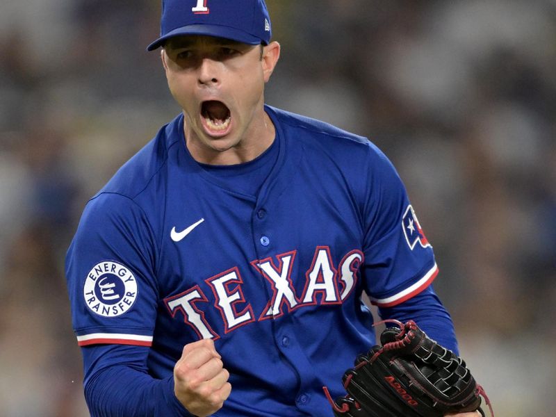 Jun 13, 2024; Los Angeles, California, USA;  Texas Rangers relief pitcher David Robertson (37) reacts after striking out Los Angeles Dodgers shortstop Mookie Betts (50), designated hitter Shohei Ohtani (17) and first baseman Freddie Freeman (5) in the eighth inning at Dodger Stadium. Mandatory Credit: Jayne Kamin-Oncea-USA TODAY Sports