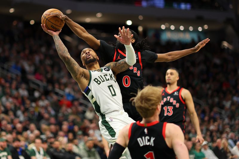 MILWAUKEE, WISCONSIN - APRIL 05: Damian Lillard #0 of the Milwaukee Bucks is fouled by Gradey Dick #1 of the Toronto Raptors during the second half of a game at Fiserv Forum on April 05, 2024 in Milwaukee, Wisconsin. NOTE TO USER: User expressly acknowledges and agrees that, by downloading and or using this photograph, User is consenting to the terms and conditions of the Getty Images License Agreement. (Photo by Stacy Revere/Getty Images)