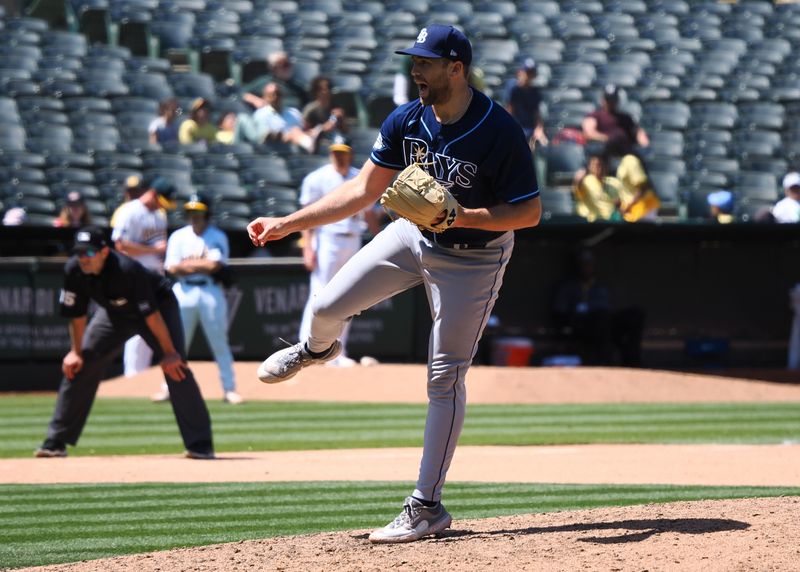 Jun 15, 2023; Oakland, California, USA; Tampa Bay Rays relief pitcher Jason Adam (47) pitches the ball against the Oakland Athletics during the eighth inning at Oakland-Alameda County Coliseum. Mandatory Credit: Kelley L Cox-USA TODAY Sports