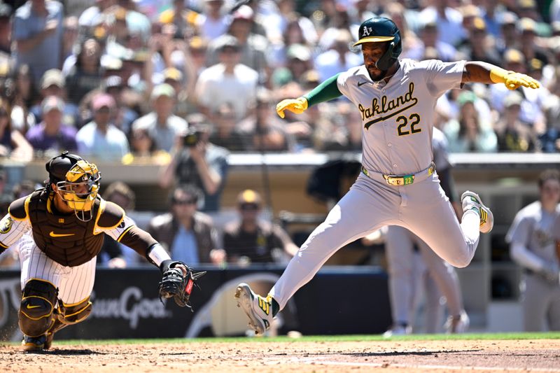 Jun 12, 2024; San Diego, California, USA; Oakland Athletics left fielder Miguel Andrujar (22) scores a run ahead of the tag by San Diego Padres catcher Luis Campusano (12) during the sixth inning at Petco Park. Mandatory Credit: Orlando Ramirez-USA TODAY Sports