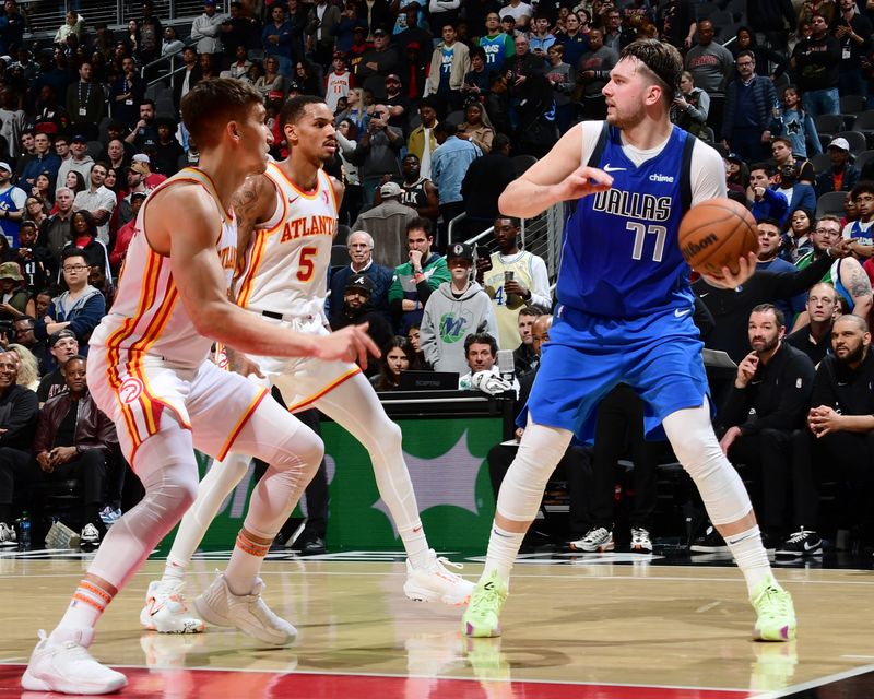 ATLANTA, GA - JANUARY 26: Luka Doncic #77 of the Dallas Mavericks looks to pass the ball during the game against the Atlanta Hawks on January 26, 2024 at State Farm Arena in Atlanta, Georgia.  NOTE TO USER: User expressly acknowledges and agrees that, by downloading and/or using this Photograph, user is consenting to the terms and conditions of the Getty Images License Agreement. Mandatory Copyright Notice: Copyright 2024 NBAE (Photo by Scott Cunningham/NBAE via Getty Images)