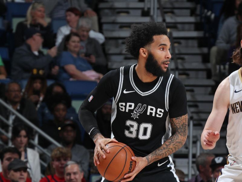 NEW ORLEANS, LA - FEBRUARY 25: Julian Champagnie #30 of the San Antonio Spurs looks to pass the ball during the game against the New Orleans Pelicans on February 25, 2025 at the Smoothie King Center in New Orleans, Louisiana. NOTE TO USER: User expressly acknowledges and agrees that, by downloading and or using this Photograph, user is consenting to the terms and conditions of the Getty Images License Agreement. Mandatory Copyright Notice: Copyright 2025 NBAE (Photo by Layne Murdoch Jr./NBAE via Getty Images)