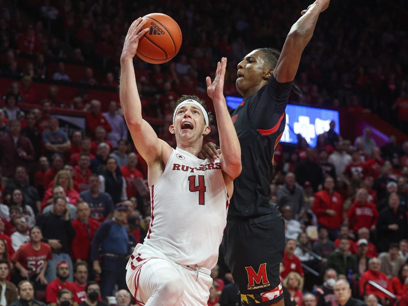 Jan 5, 2023; Piscataway, New Jersey, USA; Rutgers Scarlet Knights guard Paul Mulcahy (4) is fouled by Maryland Terrapins forward Julian Reese (10) while driving to the basket during the second half at Jersey Mike's Arena. Mandatory Credit: Vincent Carchietta-USA TODAY Sports