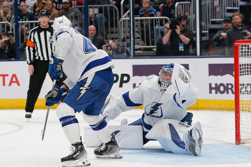 Feb 10, 2024; Columbus, Ohio, USA; Tampa Bay Lightning goalie Andrei Vasilevskiy (88) makes a glove save against the Columbus Blue Jackets during the second period at Nationwide Arena. Mandatory Credit: Russell LaBounty-USA TODAY Sports