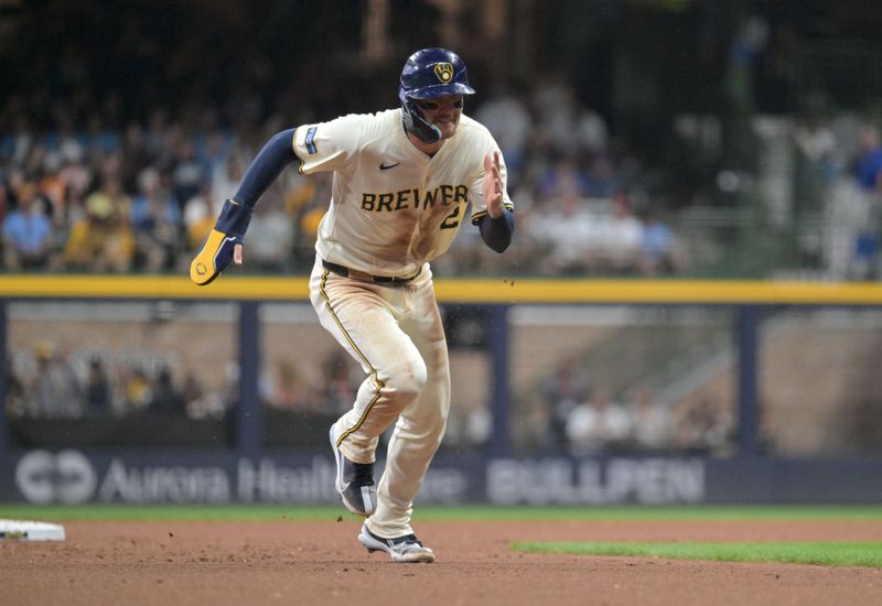 Jul 29, 2024; Milwaukee, Wisconsin, USA; Milwaukee Brewers second baseman Brice Turang (2) runs to third base against the Atlanta Braves in the sixth inning at American Family Field. Mandatory Credit: Michael McLoone-USA TODAY Sports