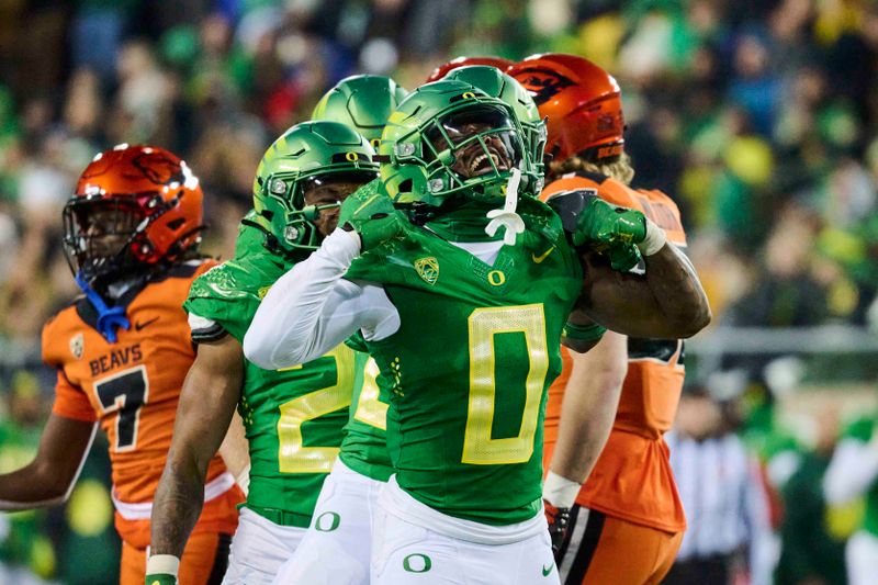 Nov 24, 2023; Eugene, Oregon, USA; Oregon Ducks defensive back Tysheem Johnson (0) celebrates after making a tackle on a kickoff return during the second half against the Oregon State Beavers at Autzen Stadium. Mandatory Credit: Troy Wayrynen-USA TODAY Sports