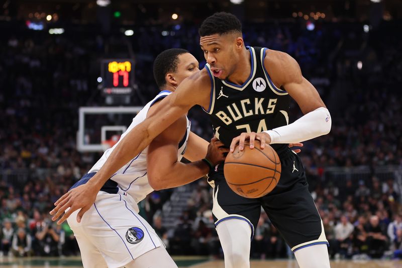 MILWAUKEE, WISCONSIN - NOVEMBER 18: Giannis Antetokounmpo #34 of the Milwaukee Bucks drives around Grant Williams #3 of the Dallas Mavericks during the first half of a game at Fiserv Forum on November 18, 2023 in Milwaukee, Wisconsin. NOTE TO USER: User expressly acknowledges and agrees that, by downloading and or using this photograph, User is consenting to the terms and conditions of the Getty Images License Agreement. (Photo by Stacy Revere/Getty Images)