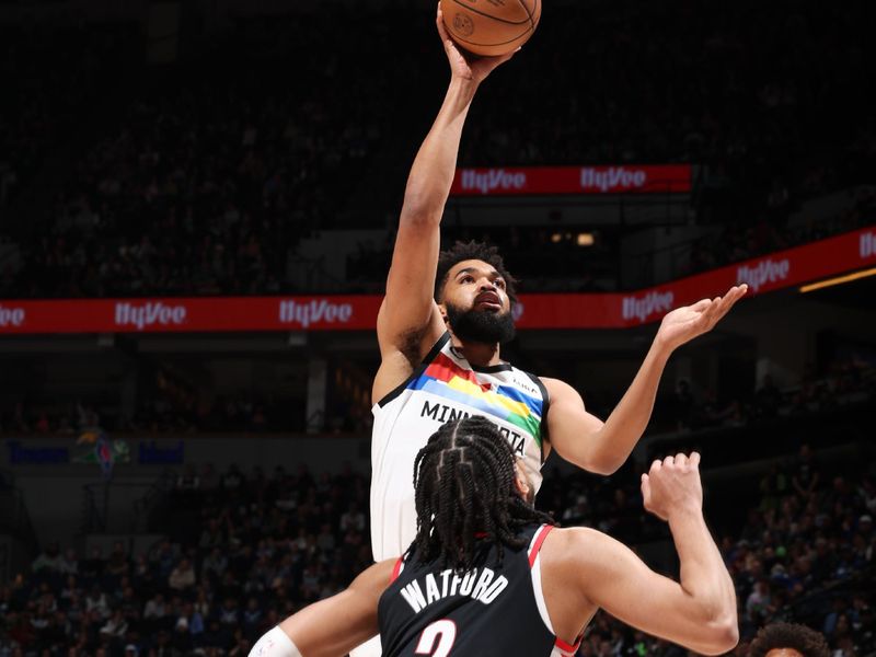 MINNEAPOLIS, MN -  APRIL 2: Karl-Anthony Towns #32 of the Minnesota Timberwolves drives to the basket during the game against the Portland Trail Blazers on April 2, 2023 at Target Center in Minneapolis, Minnesota. NOTE TO USER: User expressly acknowledges and agrees that, by downloading and or using this Photograph, user is consenting to the terms and conditions of the Getty Images License Agreement. Mandatory Copyright Notice: Copyright 2023 NBAE (Photo by David Sherman/NBAE via Getty Images)