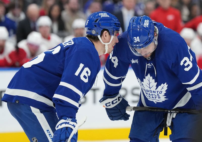 Apr 13, 2024; Toronto, Ontario, CAN; Toronto Maple Leafs right wing Mitch Marner (16) talks to Toronto Maple Leafs center Auston Matthews (34) against the Detroit Red Wings during the third period at Scotiabank Arena. Mandatory Credit: Nick Turchiaro-USA TODAY Sports