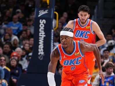 DENVER, CO - DECEMBER 16: Shai Gilgeous-Alexander #2 of the Oklahoma City Thunder brings the ball up court against the Denver Nuggets on December 16, 2023 at the Ball Arena in Denver, Colorado. NOTE TO USER: User expressly acknowledges and agrees that, by downloading and/or using this Photograph, user is consenting to the terms and conditions of the Getty Images License Agreement. Mandatory Copyright Notice: Copyright 2023 NBAE (Photo by Garrett Ellwood/NBAE via Getty Images)