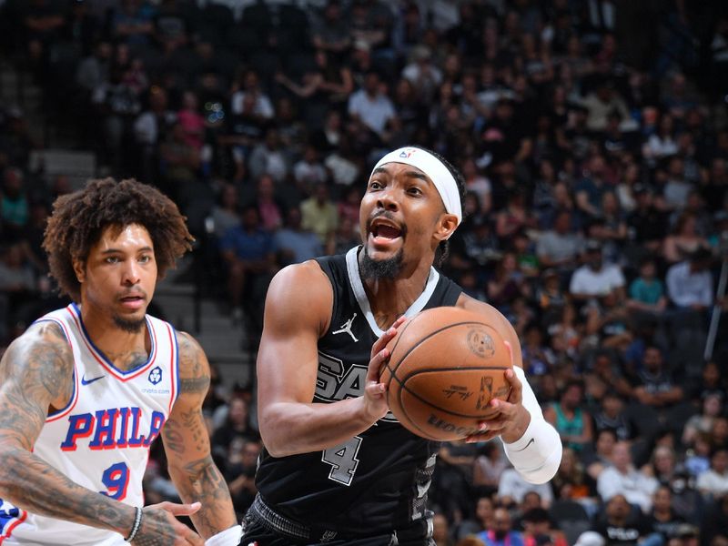 SAN ANTONIO, TX - APRIL 7:  Devonte Graham #4 of the San Antonio Spurs drives to the basket during the game against the Philadelphia 76ers on April 7, 2024 at the Frost Bank Center in San Antonio, Texas. NOTE TO USER: User expressly acknowledges and agrees that, by downloading and or using this photograph, user is consenting to the terms and conditions of the Getty Images License Agreement. Mandatory Copyright Notice: Copyright 2024 NBAE (Photos by Michael Gonzales/NBAE via Getty Images)