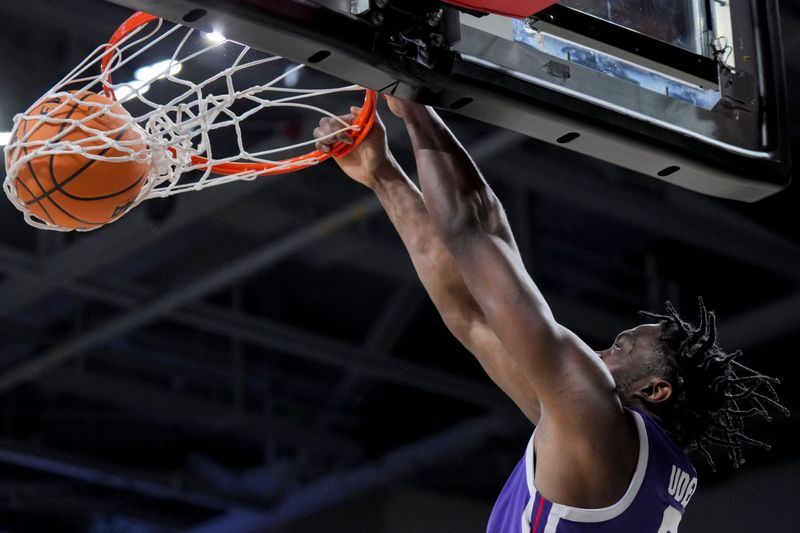 Jan 16, 2024; Cincinnati, Ohio, USA;  TCU Horned Frogs center Ernest Udeh Jr. (8) dunks the ball against the Cincinnati Bearcats in the second half at Fifth Third Arena. Mandatory Credit: Aaron Doster-USA TODAY Sports