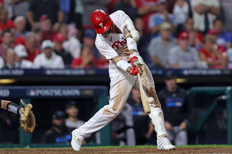 Oct 3, 2023; Philadelphia, Pennsylvania, USA; Philadelphia Phillies right fielder Nick Castellanos (8) hits a RBI double against the Miami Marlins during game one of the Wildcard series for the 2023 MLB playoffs at Citizens Bank Park. Mandatory Credit: Bill Streicher-USA TODAY Sports