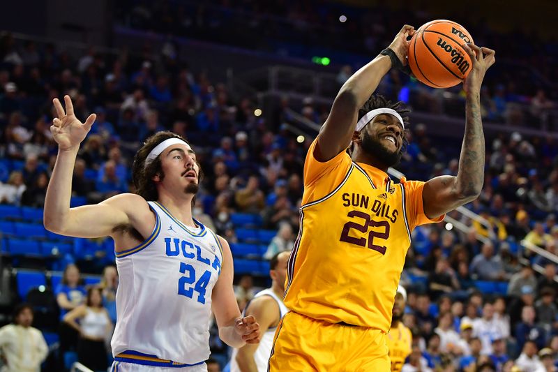 Mar 2, 2023; Los Angeles, California, USA; Arizona State Sun Devils forward Warren Washington (22) gets the rebound in front of UCLA Bruins guard Jaime Jaquez Jr. (24) during the first half at Pauley Pavilion. Mandatory Credit: Gary A. Vasquez-USA TODAY Sports