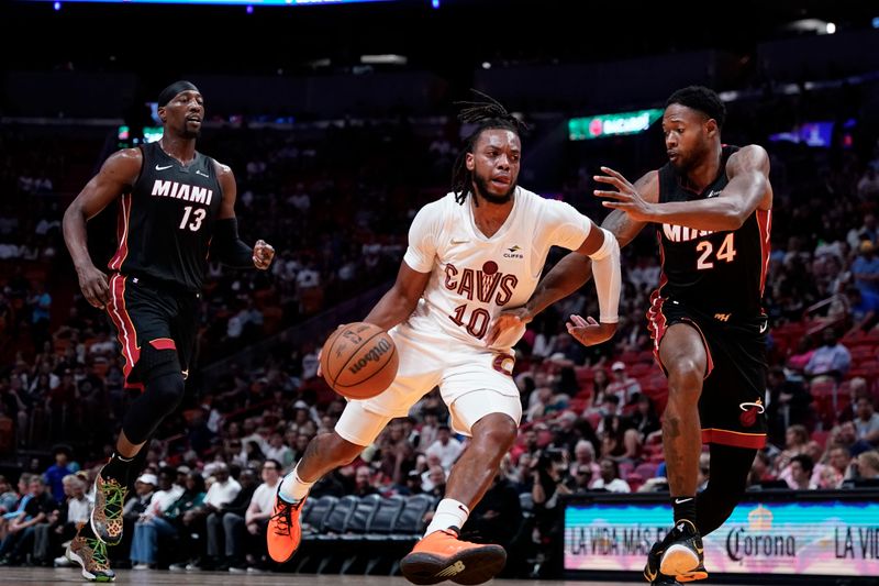 MIAMI, FLORIDA - MARCH 24: Darius Garland #10 of the Cleveland Cavaliers drives against Haywood Highsmith #24 of the Miami Heat during the first quarter at Kaseya Center on March 24, 2024 in Miami, Florida. NOTE TO USER: User expressly acknowledges and agrees that, by downloading and or using this photograph, User is consenting to the terms and conditions of the Getty Images License Agreement. (Photo by Rich Storry/Getty Images)