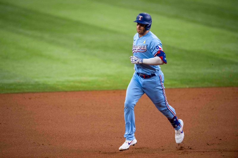 Sep 3, 2023; Arlington, Texas, USA; Texas Rangers designated hitter Mitch Garver (18) rounds the bases after he hits a three run home run against the Minnesota Twins during the first inning at Globe Life Field. Mandatory Credit: Jerome Miron-USA TODAY Sports