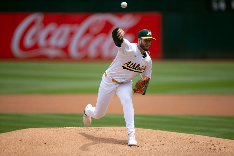 Jun 20, 2024; Oakland, California, USA; Oakland Athletics starting pitcher Mitch Spence (40) delivers a pitch against the Kansas City Royals during the first inning at Oakland-Alameda County Coliseum. Mandatory Credit: D. Ross Cameron-USA TODAY Sports