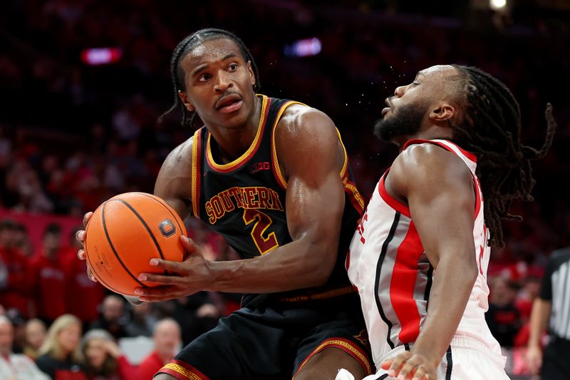 Feb 11, 2026; Columbus, Ohio, USA;  USC Trojans forward Ezra Ausar (2) goes to the basket as Ohio State Buckeyes guard Bruce Thornton (2) defends during the first half at Value City Arena. Mandatory Credit: Joseph Maiorana-Imagn Images