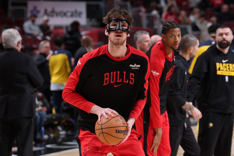 CHICAGO, IL - DECEMBER 6: Matas Buzelis #14 of Chicago Bulls warms up before the game against the Indiana Pacers on December 6, 2024 at United Center in Chicago, Illinois. NOTE TO USER: User expressly acknowledges and agrees that, by downloading and or using this photograph, User is consenting to the terms and conditions of the Getty Images License Agreement. Mandatory Copyright Notice: Copyright 2024 NBAE (Photo by Jeff Haynes/NBAE via Getty Images)