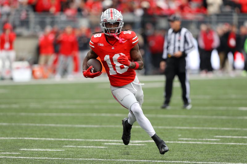 Oct 21, 2023; Columbus, Ohio, USA;  Ohio State Buckeyes wide receiver Marvin Harrison Jr. (18) scores a touchdown against the Penn State Nittany Lions during the fourth quarter at Ohio Stadium. Mandatory Credit: Joseph Maiorana-USA TODAY Sports