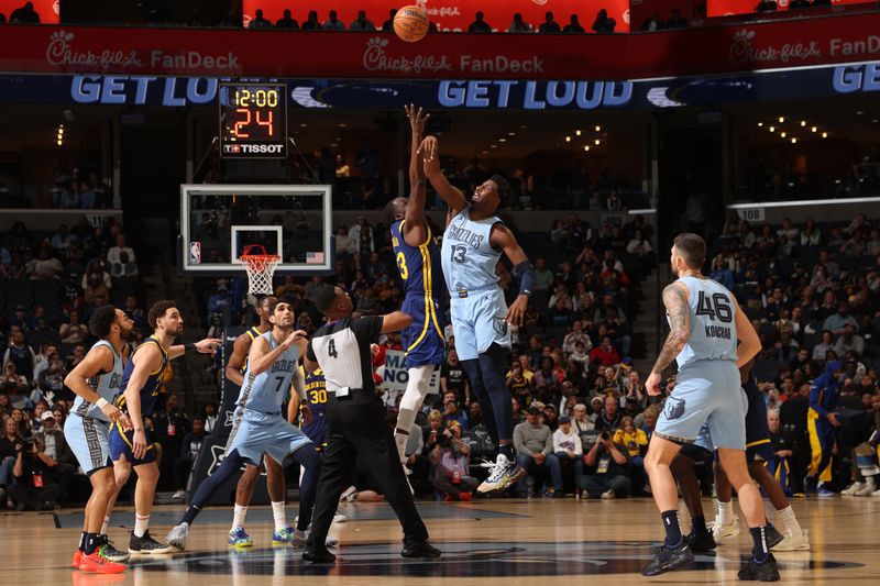 MEMPHIS, TN - FEBRUARY 2: Draymond Green #23 of the Golden State Warriors and Jaren Jackson Jr. #13 of the Memphis Grizzlies go for the opening tip-off on February 2, 2024 at FedExForum in Memphis, Tennessee. NOTE TO USER: User expressly acknowledges and agrees that, by downloading and or using this photograph, User is consenting to the terms and conditions of the Getty Images License Agreement. Mandatory Copyright Notice: Copyright 2024 NBAE (Photo by Joe Murphy/NBAE via Getty Images)