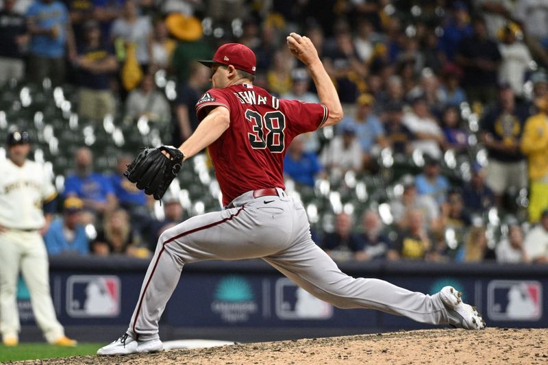 Oct 3, 2023; Milwaukee, Wisconsin, USA; Arizona Diamondbacks relief pitcher Paul Sewald (38) pitches against the Milwaukee Brewers in the ninth inning during game one of the Wildcard series for the 2023 MLB playoffs at American Family Field. Mandatory Credit: Michael McLoone-USA TODAY Sports