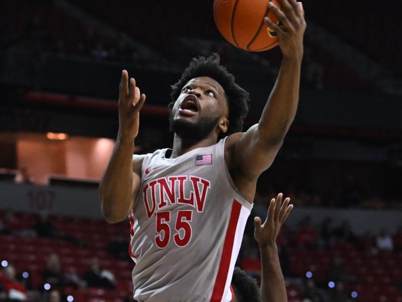 Feb 3, 2023; Las Vegas, Nevada, USA; UNLV Runnin' Rebels guard EJ Harkless (55) scores on Fresno State Bulldogs in the first half at Thomas & Mack Center. Mandatory Credit: Candice Ward-USA TODAY Sports