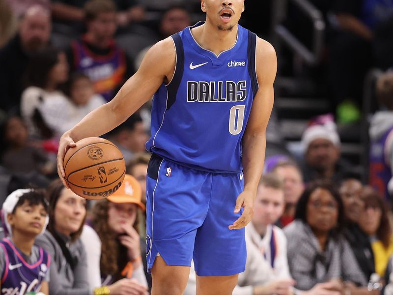 PHOENIX, ARIZONA - DECEMBER 25: Dante Exum #0 of the Dallas Mavericks handles the ball during the second half of the NBA game at Footprint Center on December 25, 2023 in Phoenix, Arizona. The Mavericks defeated the Suns 128-114. NOTE TO USER: User expressly acknowledges and agrees that, by downloading and or using this photograph, User is consenting to the terms and conditions of the Getty Images License Agreement.  (Photo by Christian Petersen/Getty Images)