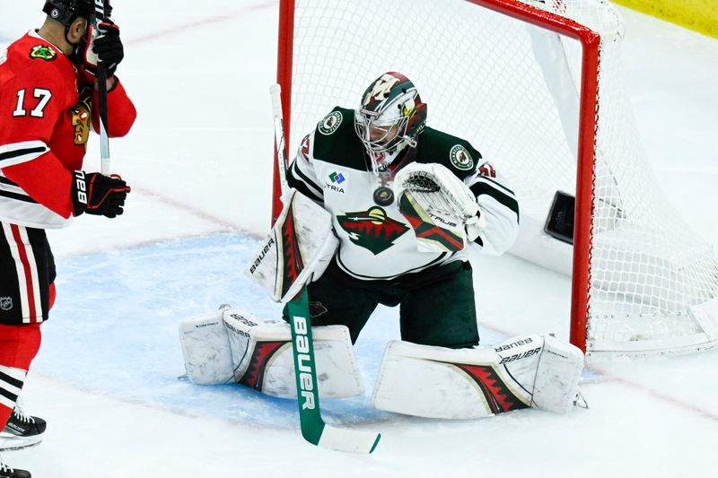 Nov 10, 2024; Chicago, Illinois, USA;  Minnesota Wild goaltender Filip Gustavsson (32) defends against the Chicago Blackhawks during the second period at the United Center. Mandatory Credit: Matt Marton-Imagn Images