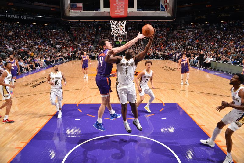 PHOENIX, AZ - APRIL 7: Zion Williamson #1 of the New Orleans Pelicans drives to the basket during the game against the Phoenix Suns on April 7, 2024 at Footprint Center in Phoenix, Arizona. NOTE TO USER: User expressly acknowledges and agrees that, by downloading and or using this photograph, user is consenting to the terms and conditions of the Getty Images License Agreement. Mandatory Copyright Notice: Copyright 2024 NBAE (Photo by Barry Gossage/NBAE via Getty Images)