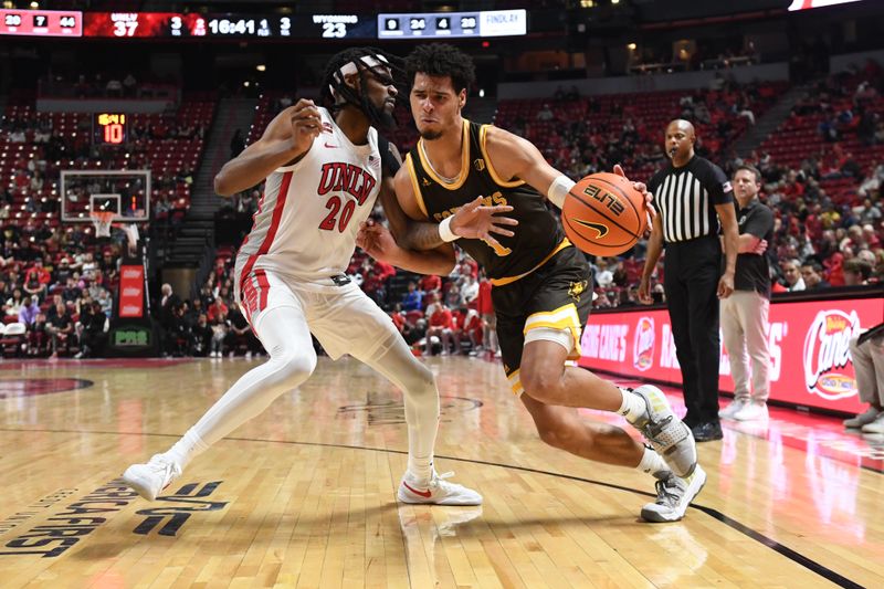 Feb 3, 2024; Las Vegas, Nevada, USA; Wyoming Cowboys guard Brendan Wenzel (1) drives past UNLV Rebels forward Keylan Boone (20) in the second half at Thomas & Mack Center. Mandatory Credit: Candice Ward-USA TODAY Sports