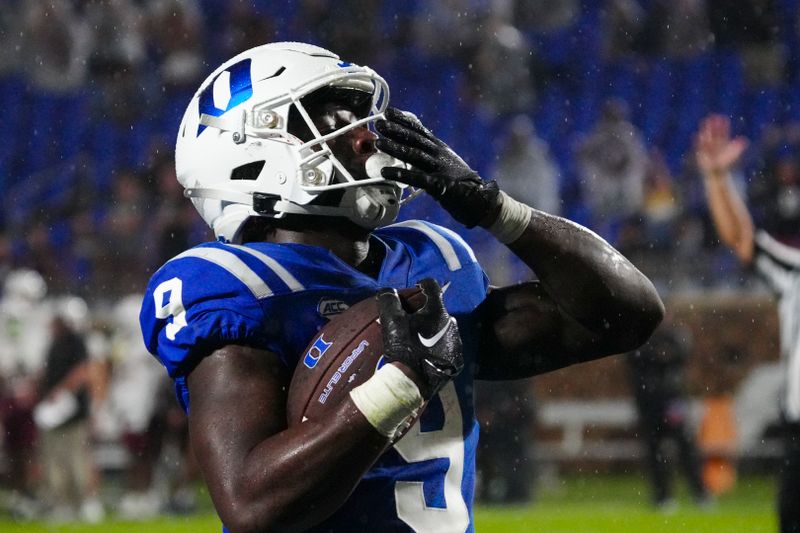 Sep 9, 2023; Durham, North Carolina, USA;  Duke Blue Devils running back Jaquez Moore (9) celebrates his touchdown run against the Lafayette Leopards during the second half at Wallace Wade Stadium. Mandatory Credit: James Guillory-USA TODAY Sports