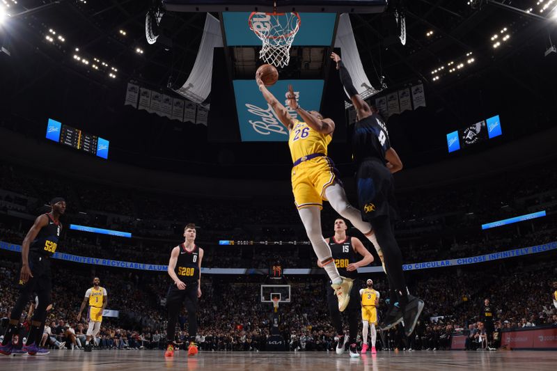 DENVER, CO - APRRIL 22: Spencer Dinwiddie #26 of the Los Angeles Lakers drives to the basket during the game against the Denver Nuggets during Round 1 Game 2 of the 2024 NBA Playoffs on April 22, 2024 at the Ball Arena in Denver, Colorado. NOTE TO USER: User expressly acknowledges and agrees that, by downloading and/or using this Photograph, user is consenting to the terms and conditions of the Getty Images License Agreement. Mandatory Copyright Notice: Copyright 2024 NBAE (Photo by Garrett Ellwood/NBAE via Getty Images)