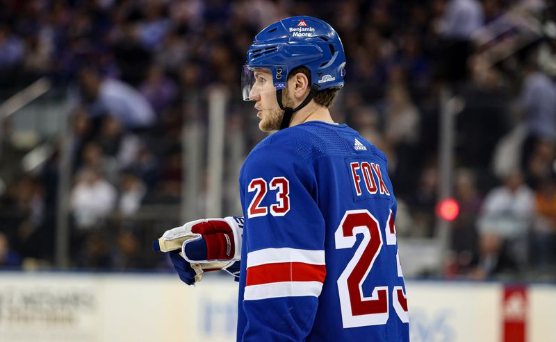 Apr 11, 2024; New York, New York, USA; New York Rangers defenseman Adam Fox (23) points toward the bench during the first period against the Philadelphia Flyers at Madison Square Garden. Mandatory Credit: Danny Wild-USA TODAY Sports