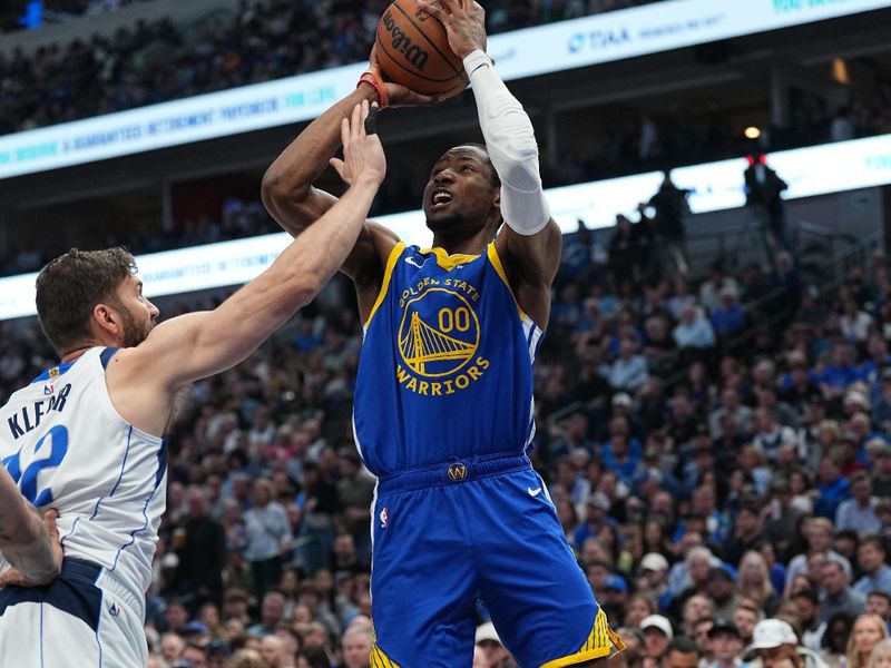 DALLAS, TX - MARCH 13: Jonathan Kuminga #00 of the Golden State Warriors shoots the ball during the game against the Dallas Mavericks on March 13, 2024 at the American Airlines Center in Dallas, Texas. NOTE TO USER: User expressly acknowledges and agrees that, by downloading and or using this photograph, User is consenting to the terms and conditions of the Getty Images License Agreement. Mandatory Copyright Notice: Copyright 2024 NBAE (Photo by Glenn James/NBAE via Getty Images)