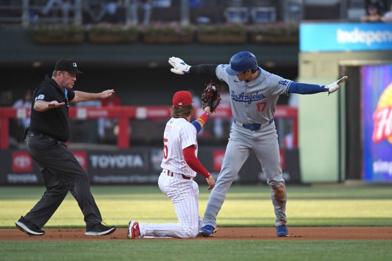 Jul 10, 2024; Philadelphia, Pennsylvania, USA; Los Angeles Dodgers two-way player Shohei Ohtani (17) steals second base ahead of tag by Philadelphia Phillies second base Bryson Stott (5) during the first inning at Citizens Bank Park. Mandatory Credit: Eric Hartline-USA TODAY Sports